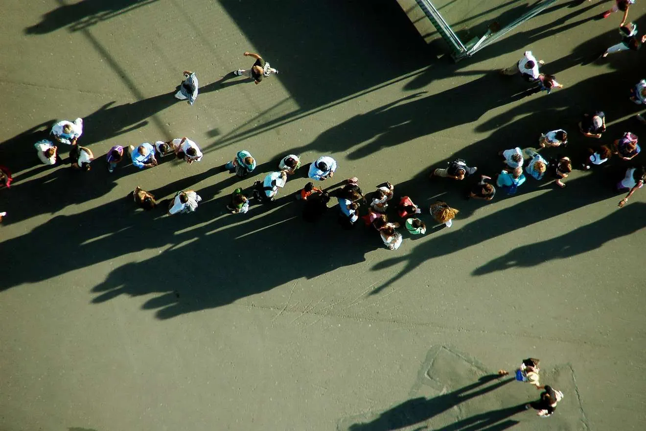 A long queue of people, seen from high above